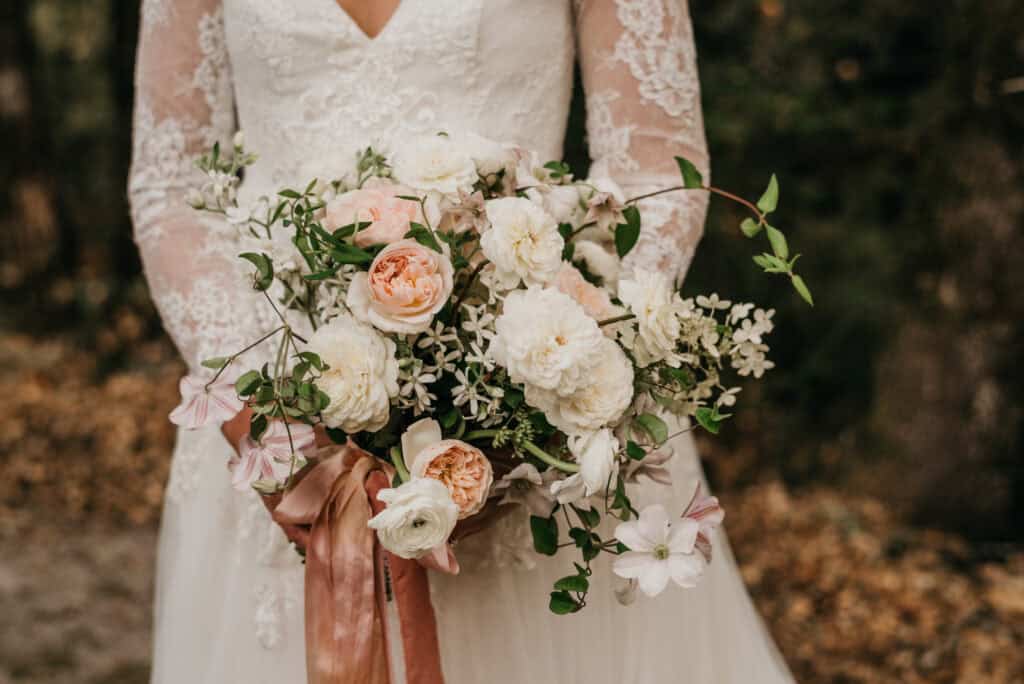 a bride holding a wedding bouquet